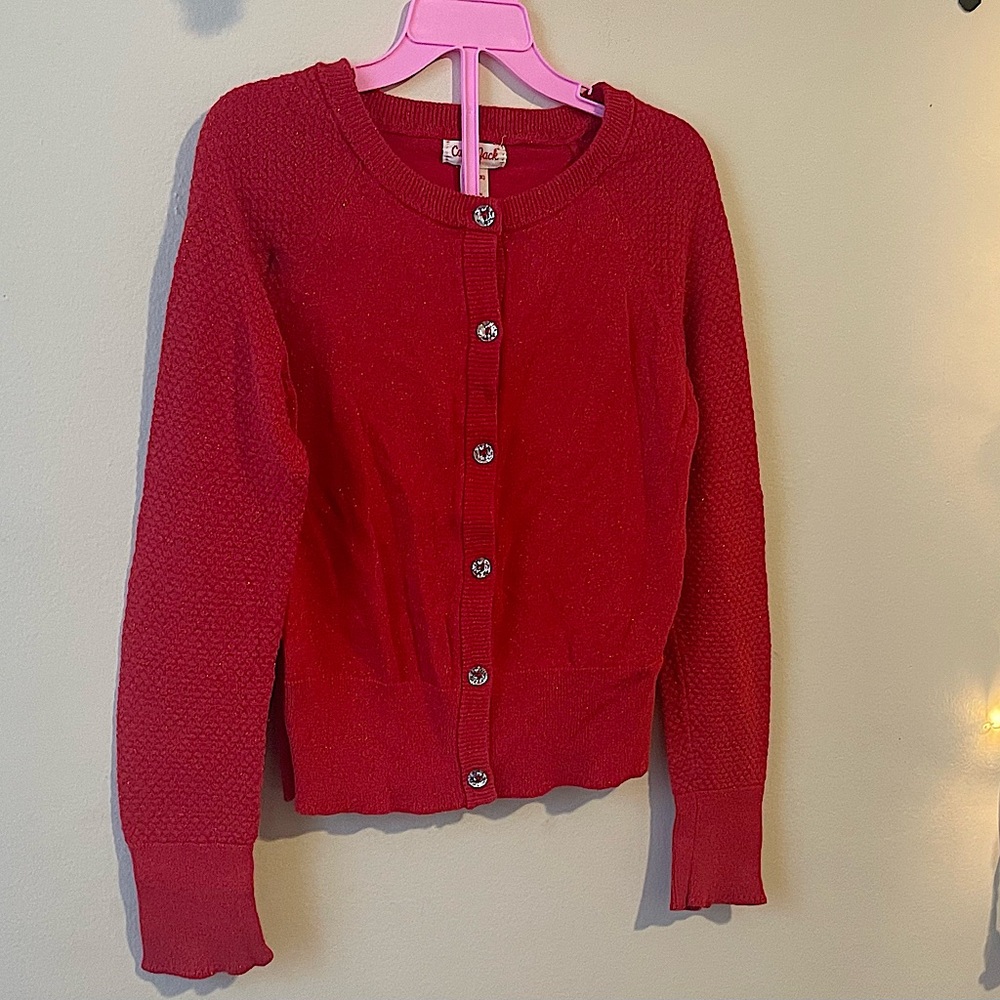 Girls red Cat & Jack cardigan. It’s glittery with sparkly buttons.